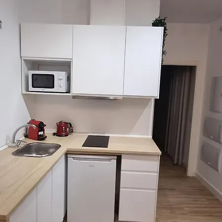 En El Centro Bajo A *