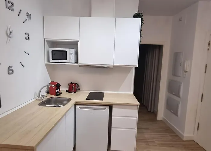 En El Centro Bajo A *