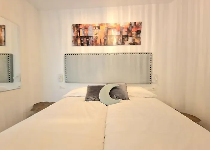 En El Centro Bajo A *